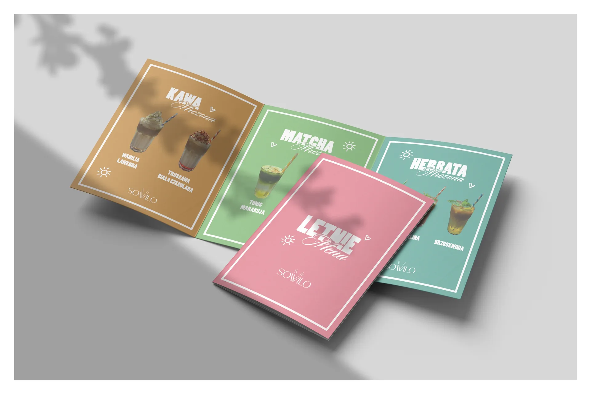 sowilo café summer menu booklet open to a colorful spread, with each drink category set in its own color system
